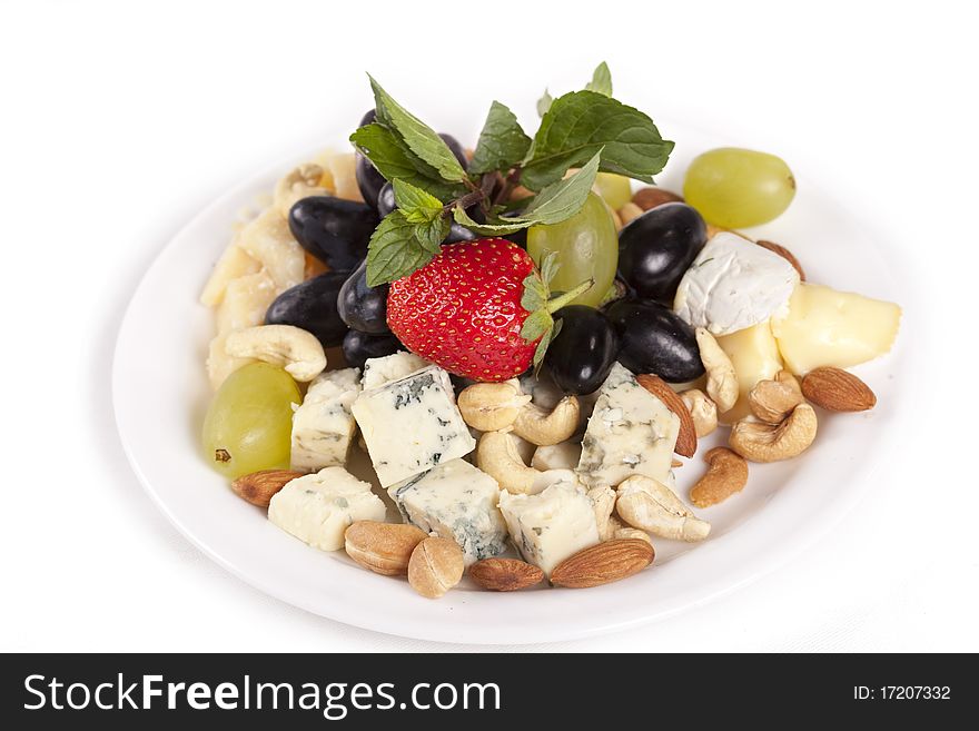 Cheese plate with grapes, nuts and strawberry. Cheese plate with grapes, nuts and strawberry