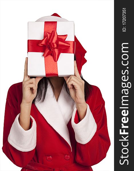 Young Santa covering her face by a gift box isolated on white