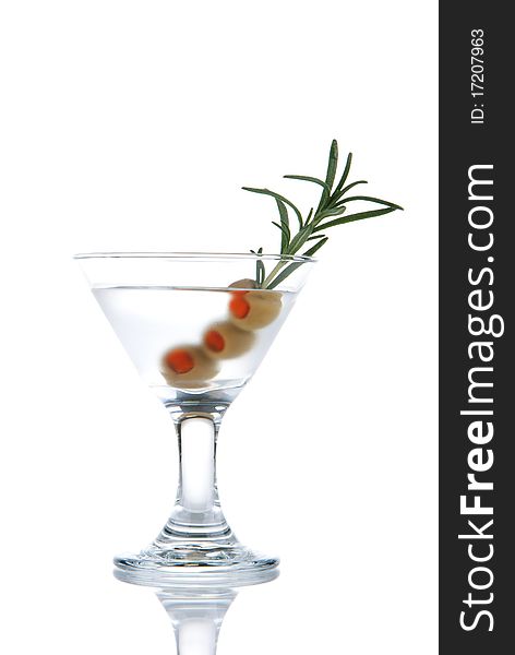 Classic Martini cocktail with Gin, dry vermouth, three olives and rosemary isolated on a white background. Classic Martini cocktail with Gin, dry vermouth, three olives and rosemary isolated on a white background