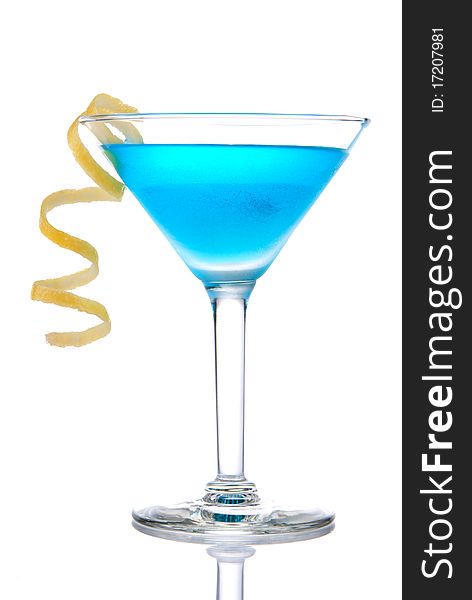 Blue tropical cocktail with lemon spiral isolated on a white background