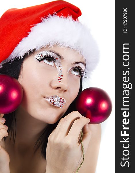 Female In Christmass Hat Holds A Red Spheres