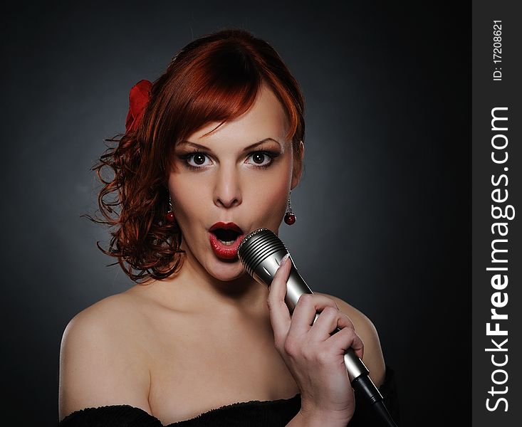 Beautiful singing redhead woman