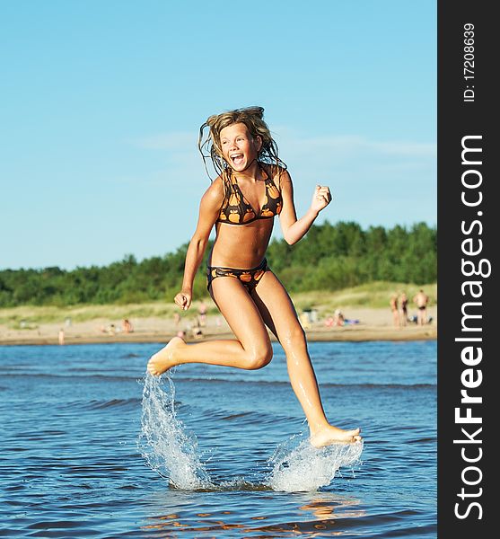 Girl running in the sea