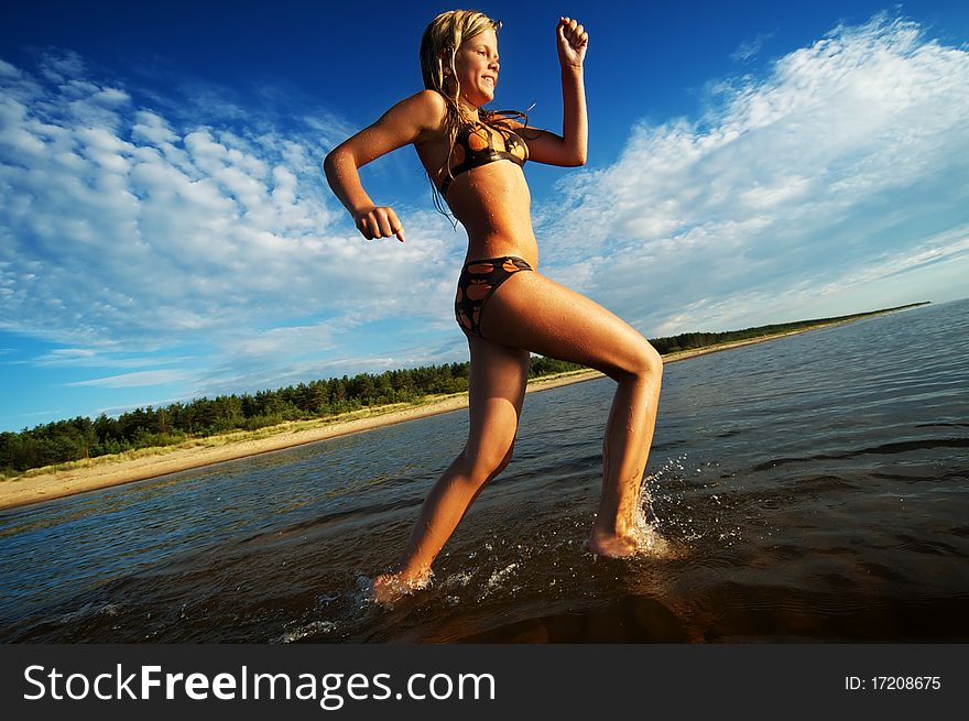 Girl running in the sea