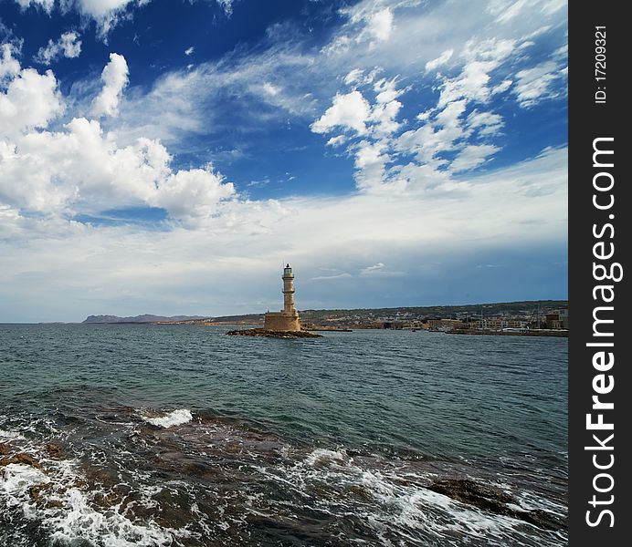 Beautiful lighthouse over blue cloudy sky