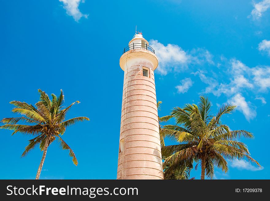 Beautiful lighthouse on the shore of the Indian Ocean