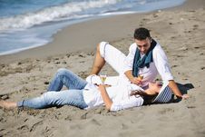 Young Couple Enjoying Picnic On The Beach Royalty Free Stock Photos Young Couple Enjoying Picnic On The Beach Royalty Free Stock Photos