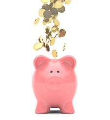 Piggy Bank And Coins Royalty Free Stock Photos