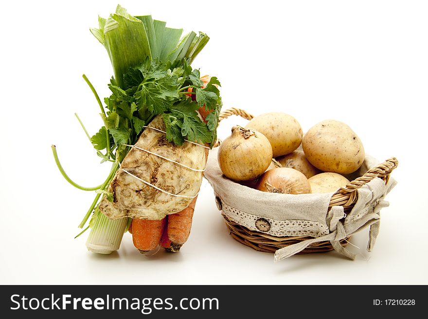 Soup vegetables and potatoes with onion in the basket