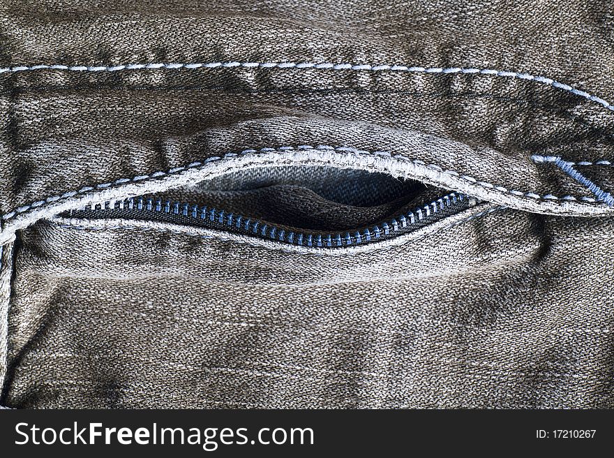 Close up of a zipper on a pair of old jeans. Close up of a zipper on a pair of old jeans