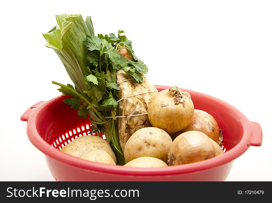 Soup vegetable with potato and onion in the kitchen sieve. Soup vegetable with potato and onion in the kitchen sieve