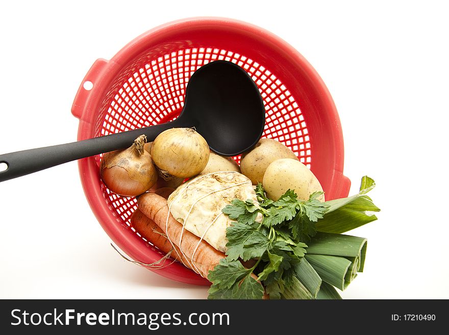 Soup vegetables with onion and ladles in the sieve. Soup vegetables with onion and ladles in the sieve