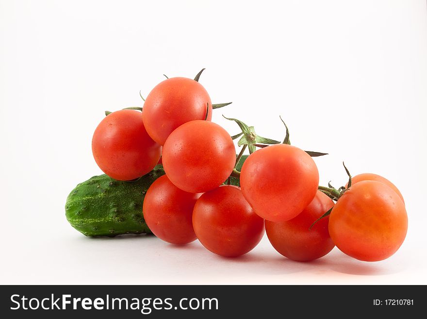 Tomatoes and cucumbers on a white background. Healthy food for people.