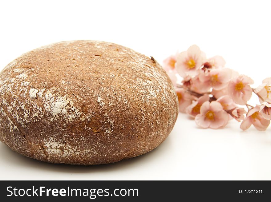 Round wheat bread onto white background. Round wheat bread onto white background