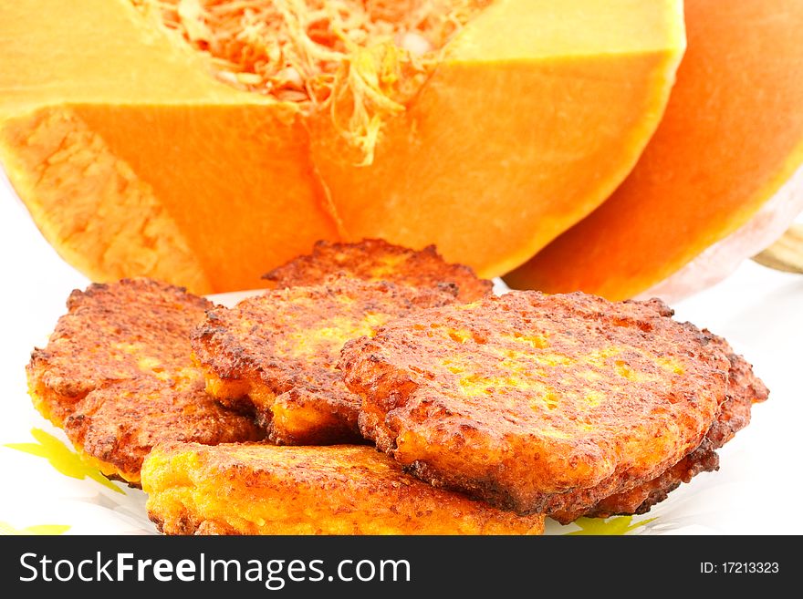 Pumpkin pancakes on the background of a large pumpkin