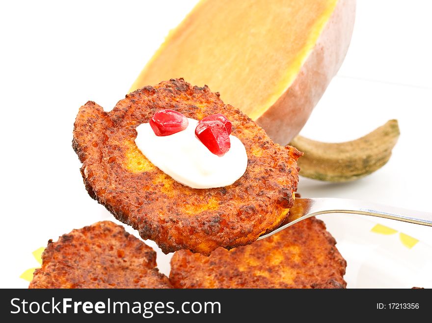 Pumpkin pancakes on the background of a large pumpkin