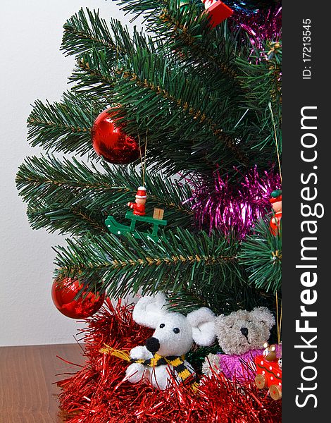 Christmas trinkets hanging on fir tree. Christmas trinkets hanging on fir tree