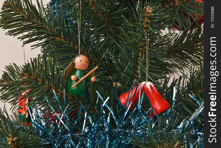 Wooden fairy and bells on the christmas tree. Wooden fairy and bells on the christmas tree