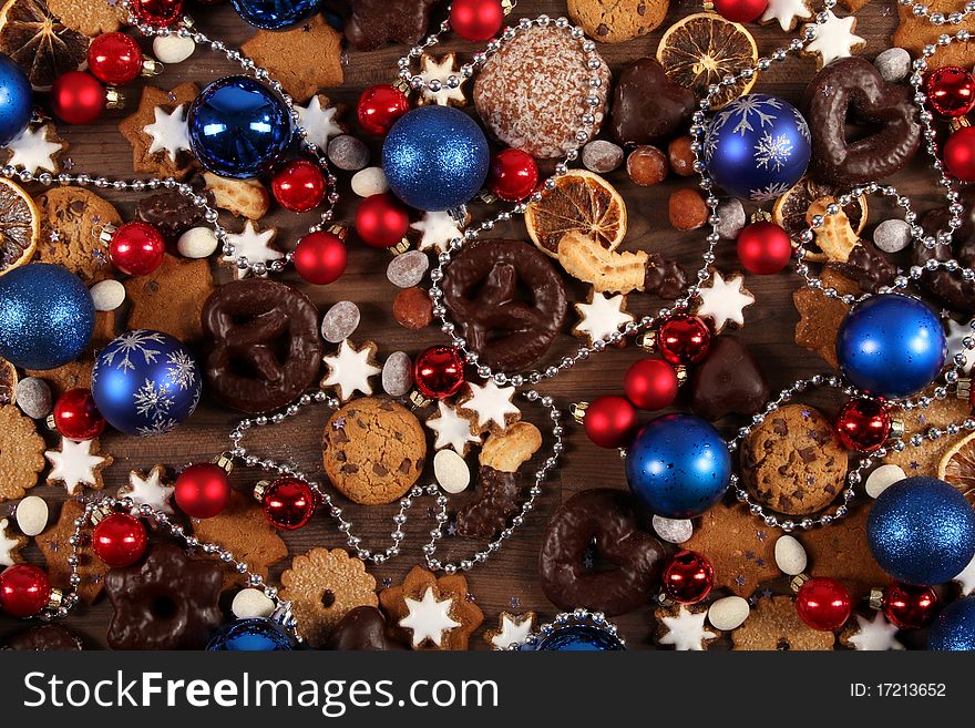 Still-live with some christmas cookies, cinnamon stars, chocolate and nuts. Still-live with some christmas cookies, cinnamon stars, chocolate and nuts