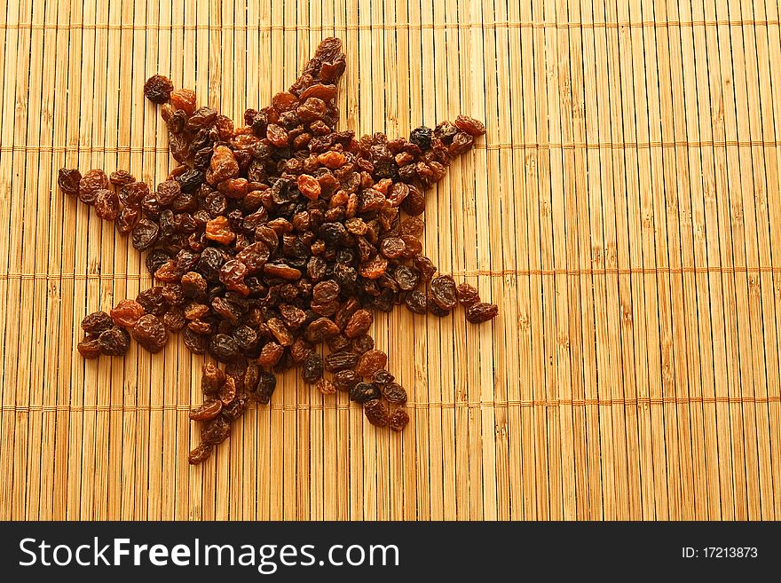 Raisins in the form of a sun/star, background