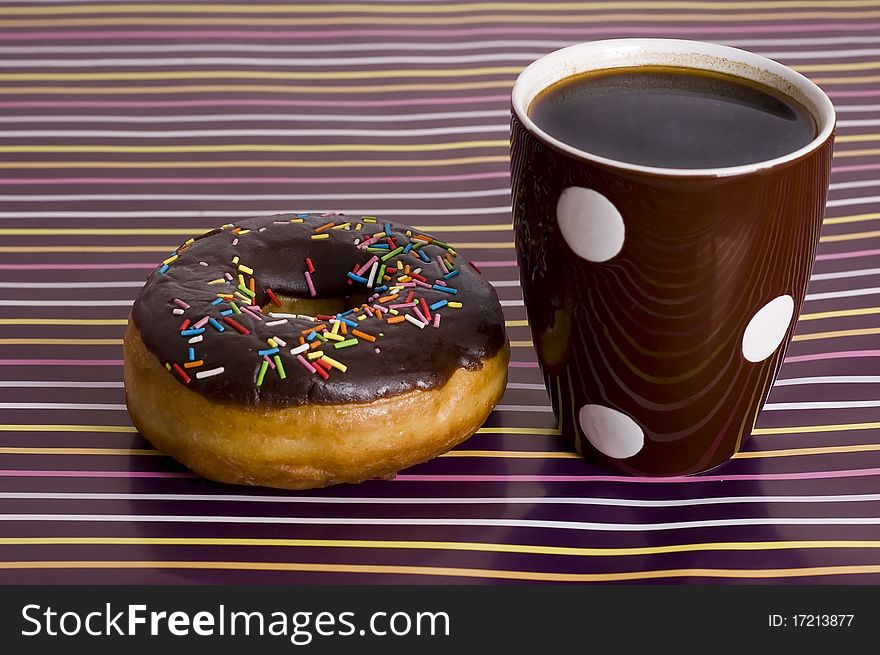 Chocolate iced donut and cup of coffee. Chocolate iced donut and cup of coffee