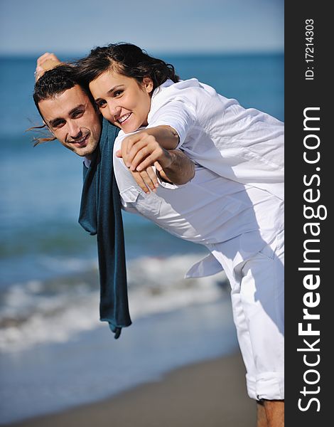 Happy young couple in white clothing  have romantic recreation and   fun at beautiful beach on  vacations. Happy young couple in white clothing  have romantic recreation and   fun at beautiful beach on  vacations