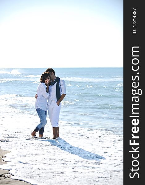 Happy Young Couple Have Fun At Beautiful Beach