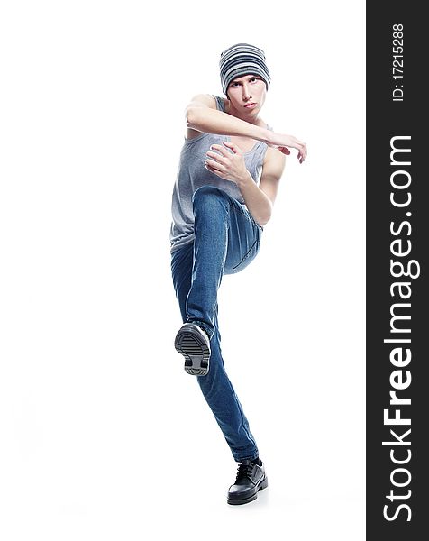 Studio portrait of young hip-hop dancer over white