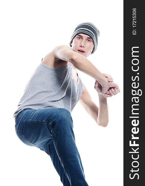 Studio portrait of young hip-hop dancer over white