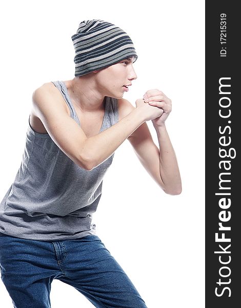 Studio portrait of young hip-hop dancer over white