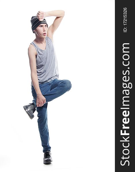 Studio portrait of young hip-hop dancer over white