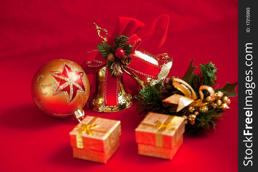 Christmas decoration with bell on red background . Christmas decoration with bell on red background .