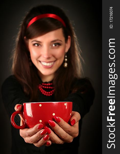 Beautiful retro woman with red cup