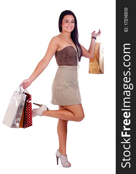 A happy girl holding shopping bags, on a white background. A happy girl holding shopping bags, on a white background.