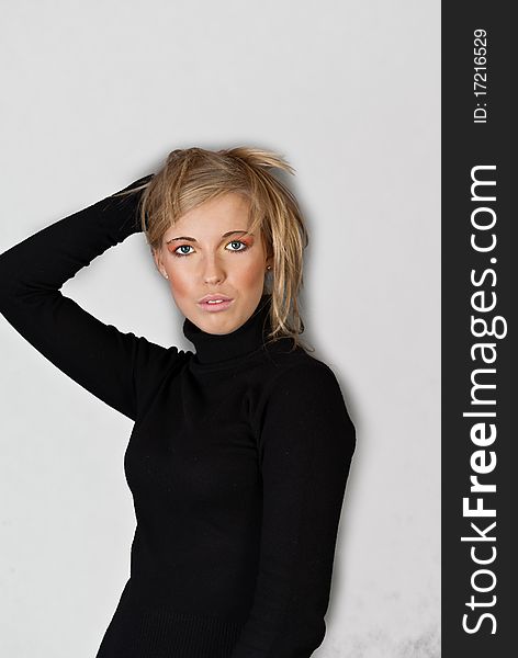 Portrait of blond woman on gray background. Portrait of blond woman on gray background