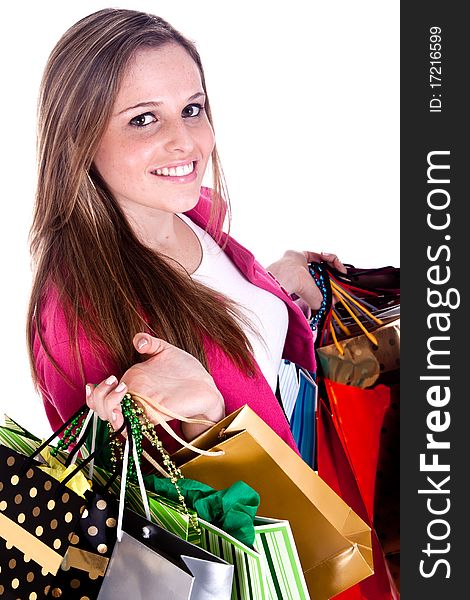 A happy girl holding shopping bags, on a white background. A happy girl holding shopping bags, on a white background.