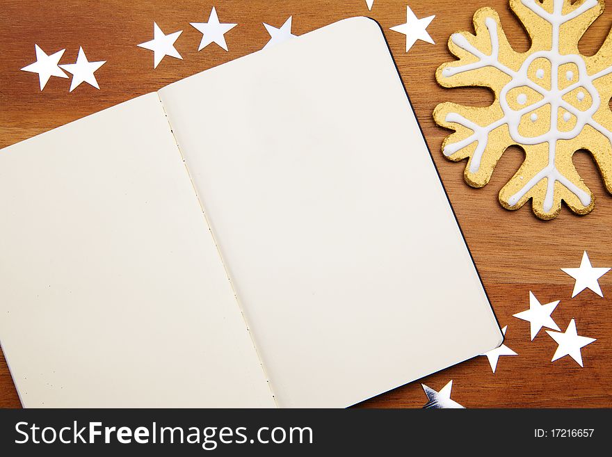 Blank Notebook With Snowflake And Stars On Wooden Background