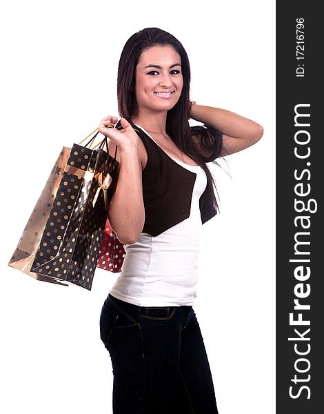 A happy girl holding shopping bags, on a white background. A happy girl holding shopping bags, on a white background.