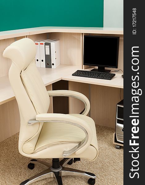 White leather armchair in a modern office