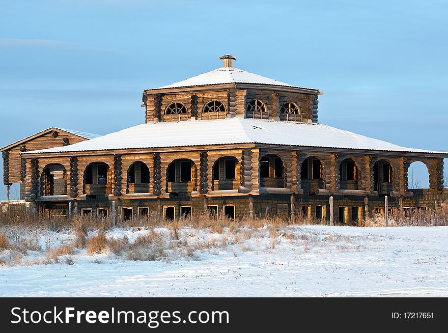 Building old-style against the blue sky. Winter