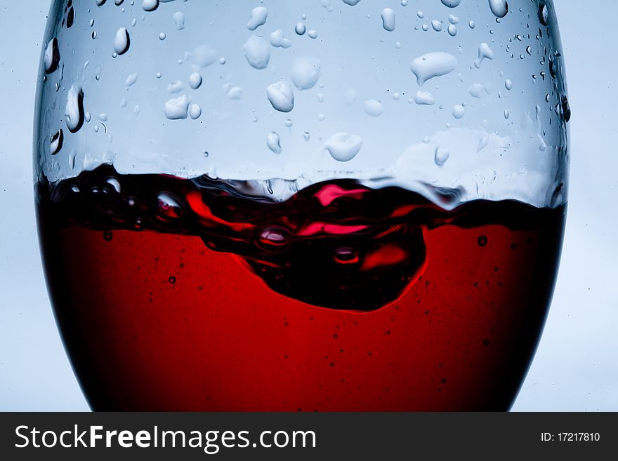 Close up of wet glass isolated on light background