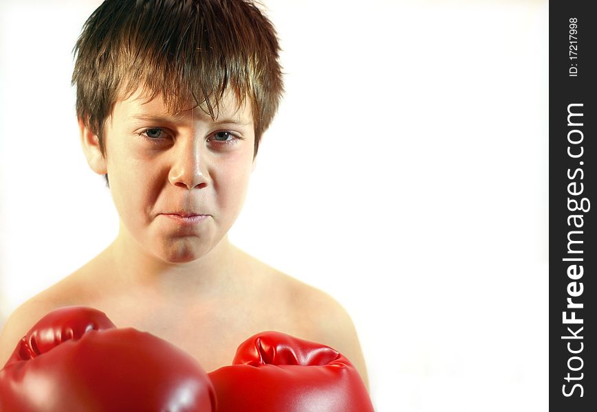 Young boxer with a red pair of boxing gloves. Young boxer with a red pair of boxing gloves