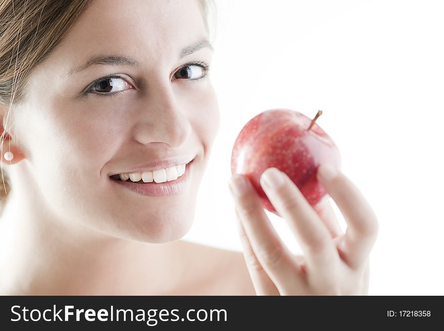 Beautiful woman eating a red apple. Beautiful woman eating a red apple