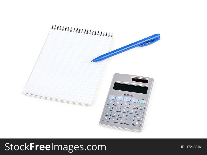 Calculator and paper notebook with blue pen