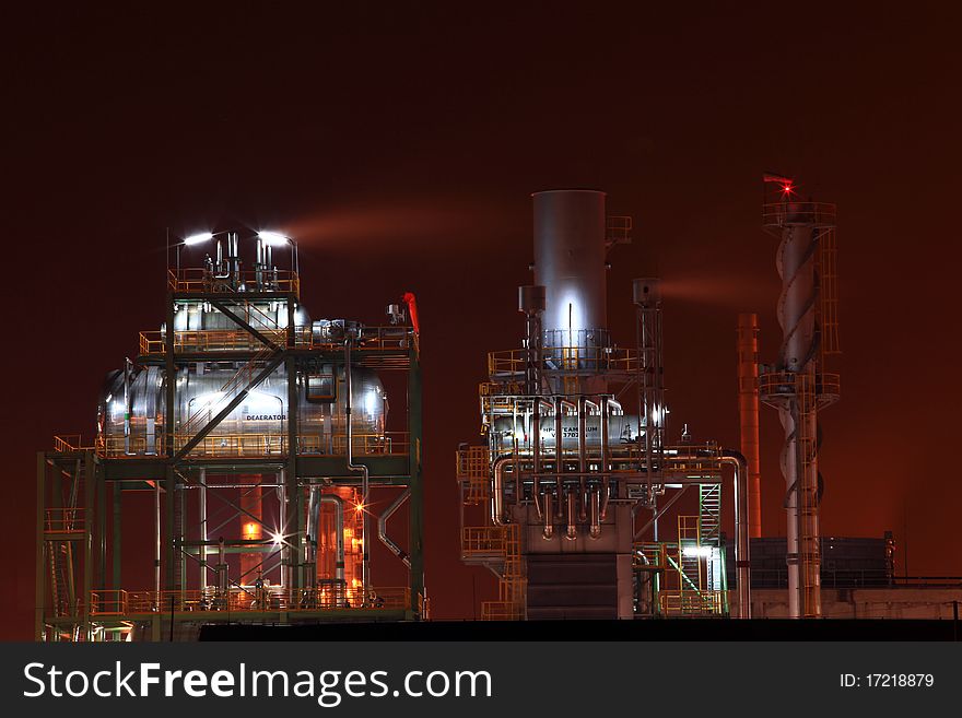 Closeup of petrochemical oil refinery factory with storage tank. Closeup of petrochemical oil refinery factory with storage tank