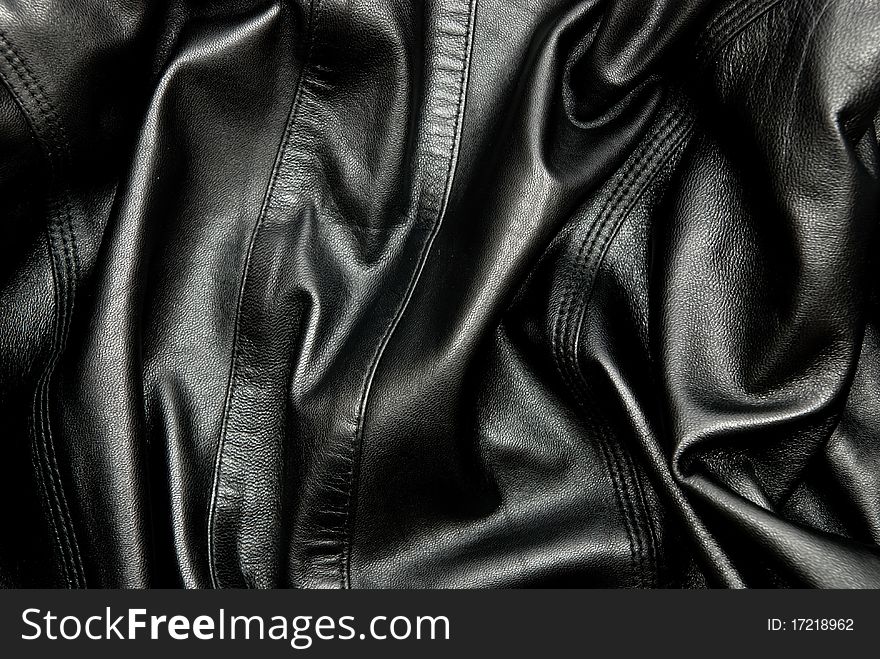 Natural black leather texture. Studio shot. Natural black leather texture. Studio shot