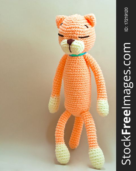 Knitted cat toy isolated on gray background