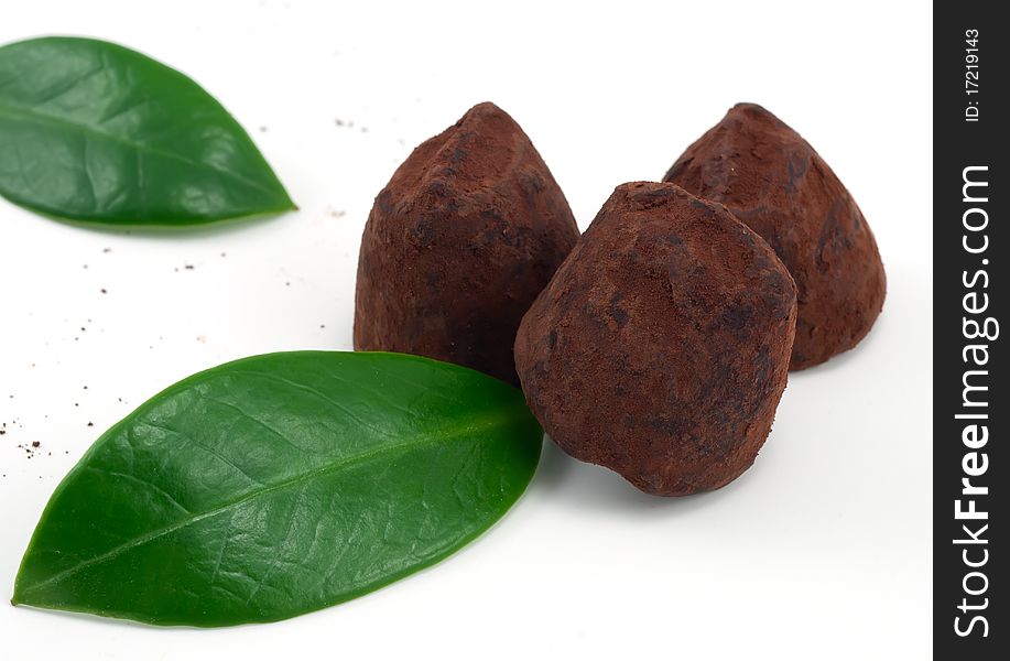 Studio shot of chocolate truffles on white background
