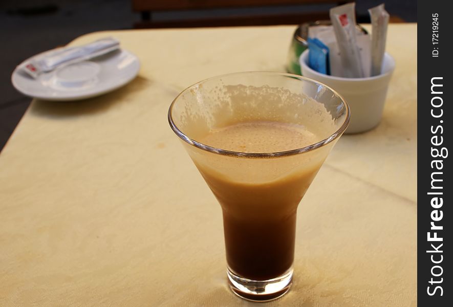 A glass of creamy coffee to break the monotony of the afternoon
