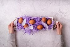 Woman Hands Holding White Wooden Box With Chicken Eggs On White Marble Background Top View Flat Lay Stock Images